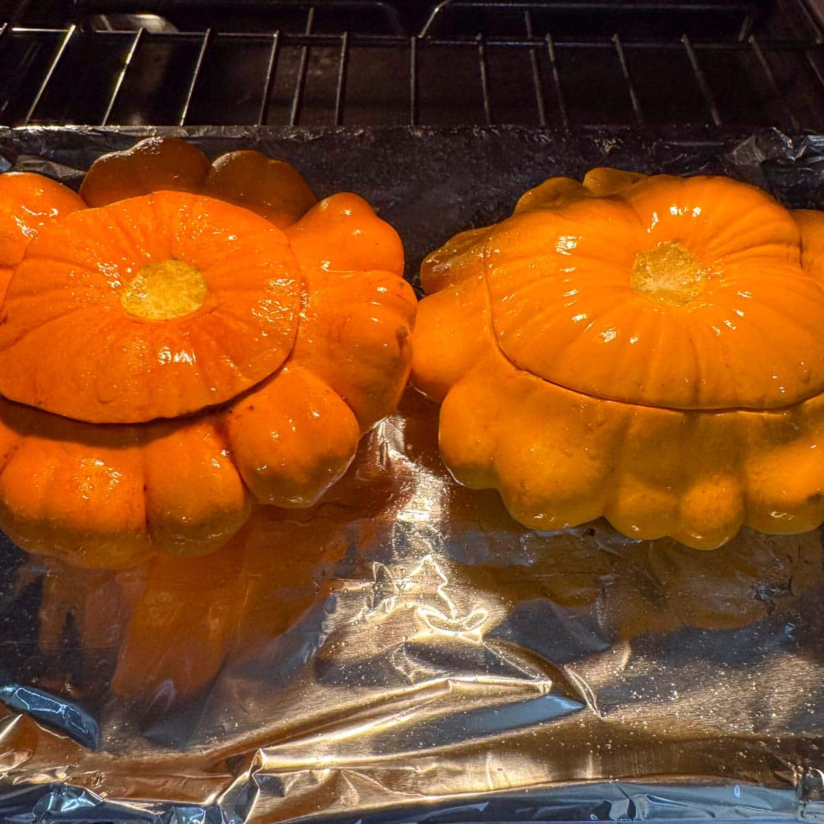 2 pattypan squash on a baking sheet. 