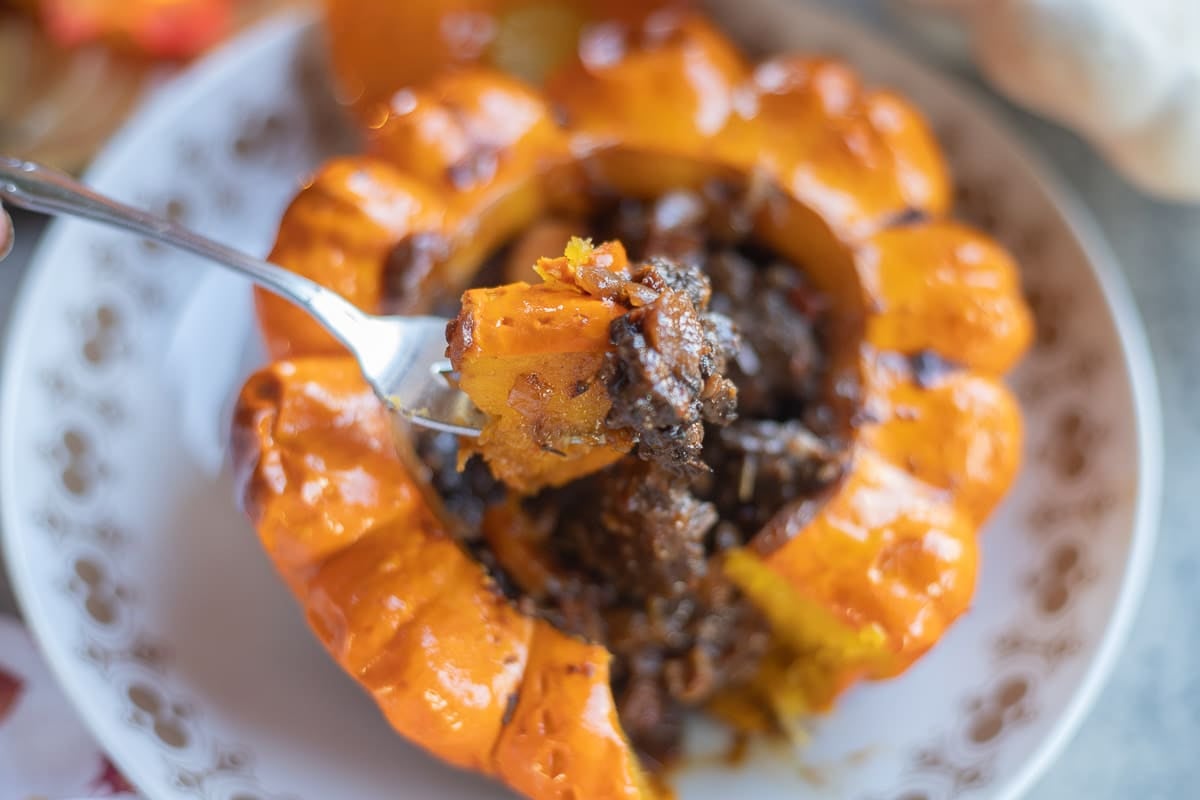 a fork with pattypan squash and beef filling. 