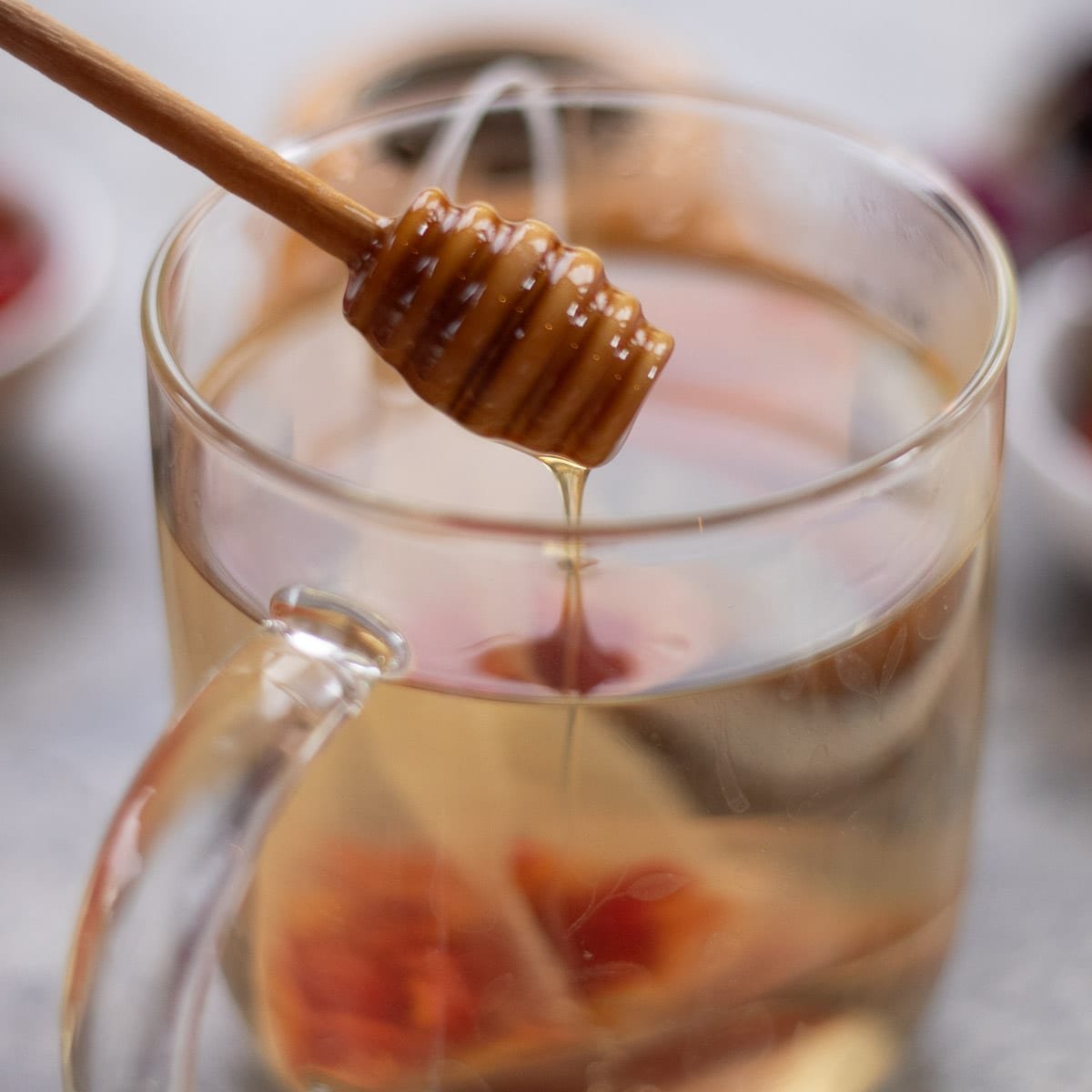 sweetening tea with honey. 