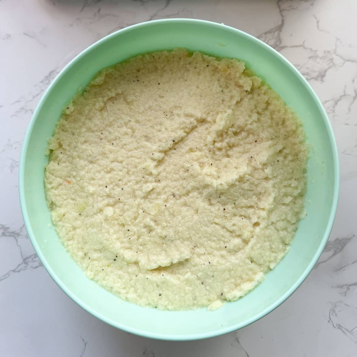 Deruny mixture in bowl after combining all ingredients.