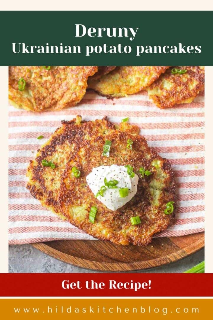 Ukrainian potato pancakes on striped mat topped with sour cream and green onions.