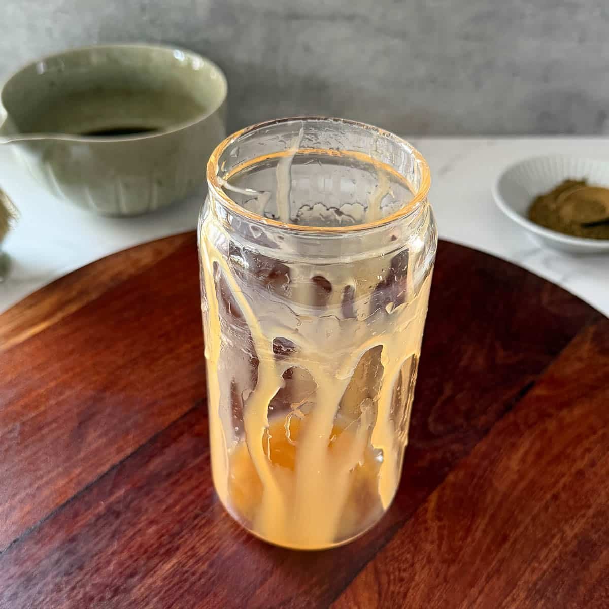 caramel syrup coating sides of glass.