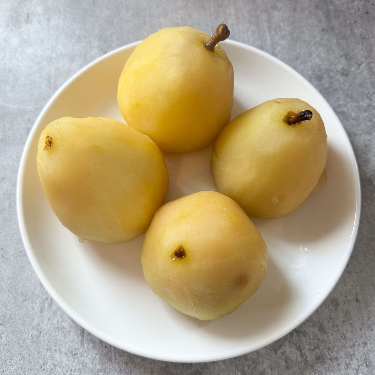poached pears on plate.