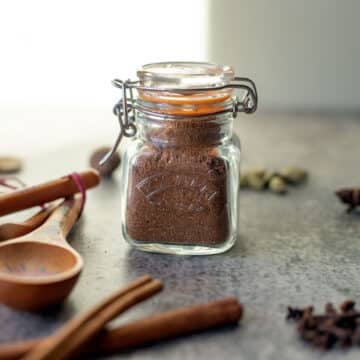 Lebkuchengewürz in a jar with spices around it