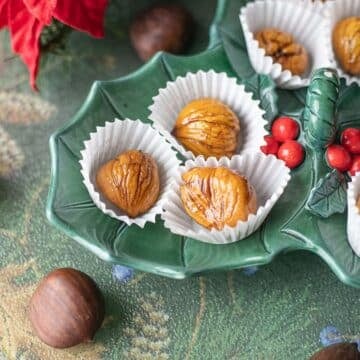 candied chestnuts on a green plate.