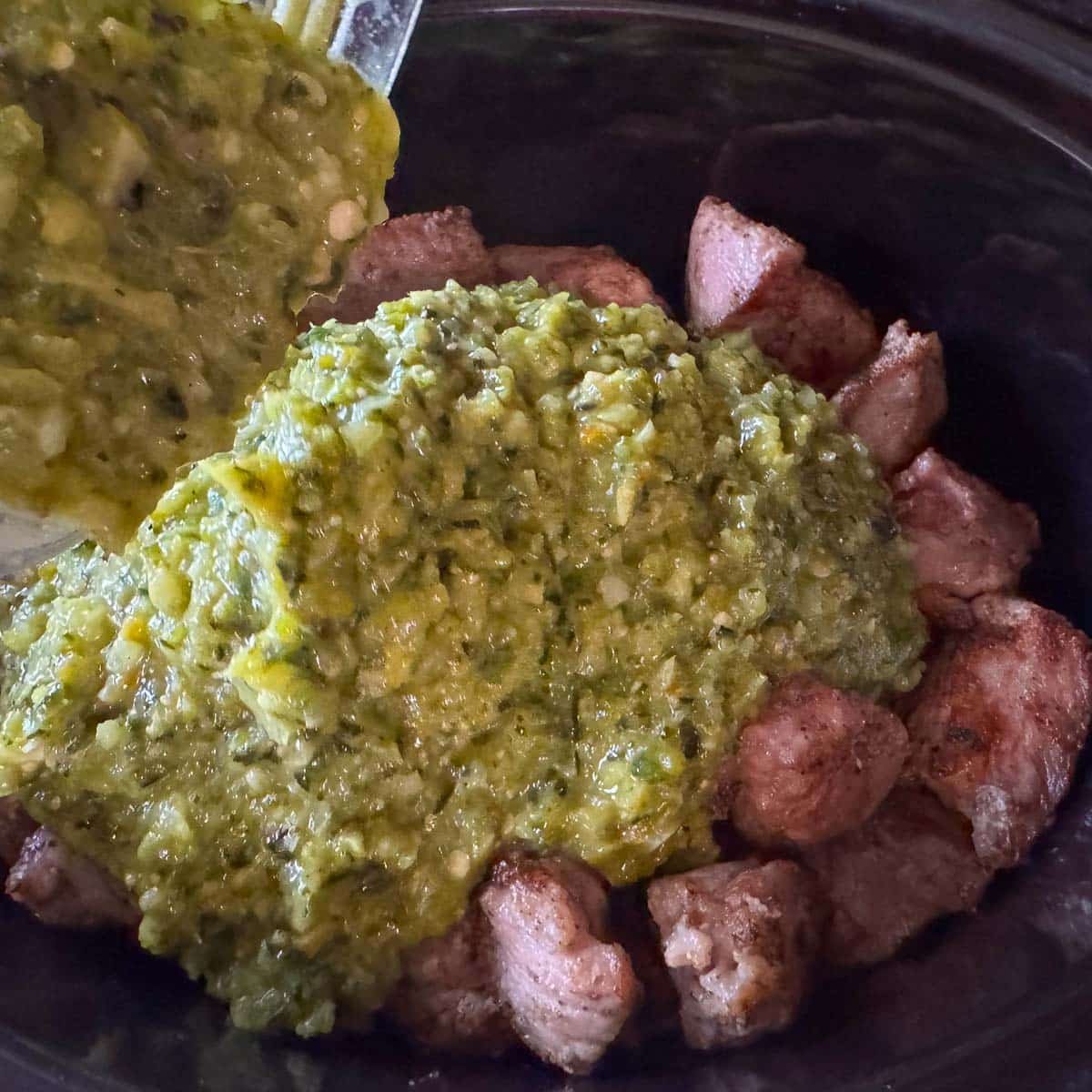 cubed pork covered with ground roasted veggies