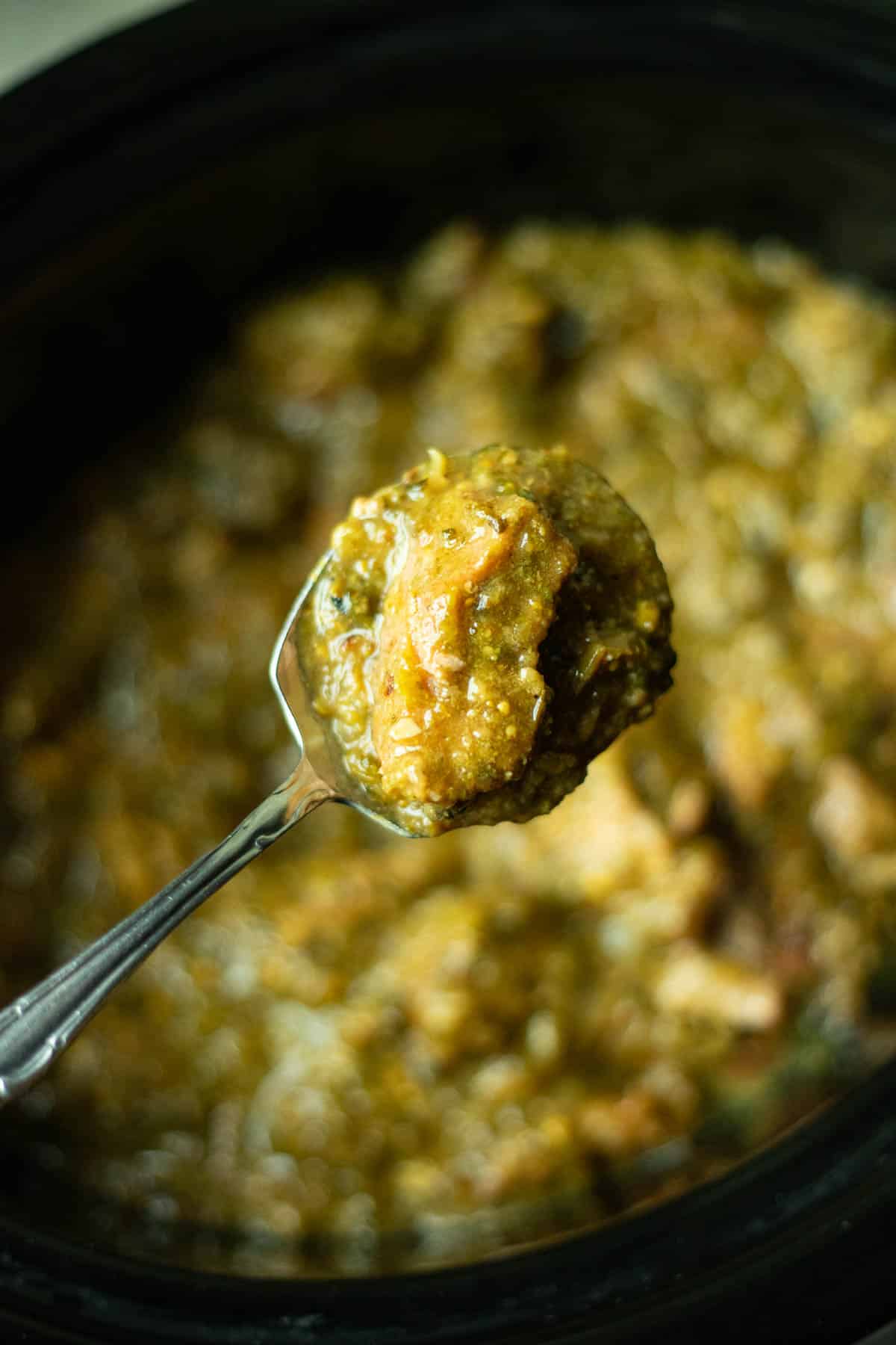 crockpot chili verde in a spoon