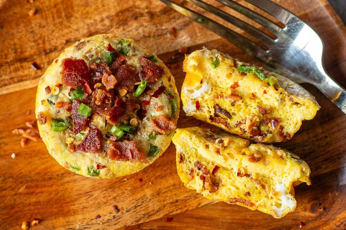 baked egg muffins on plate (one halved, one whole)