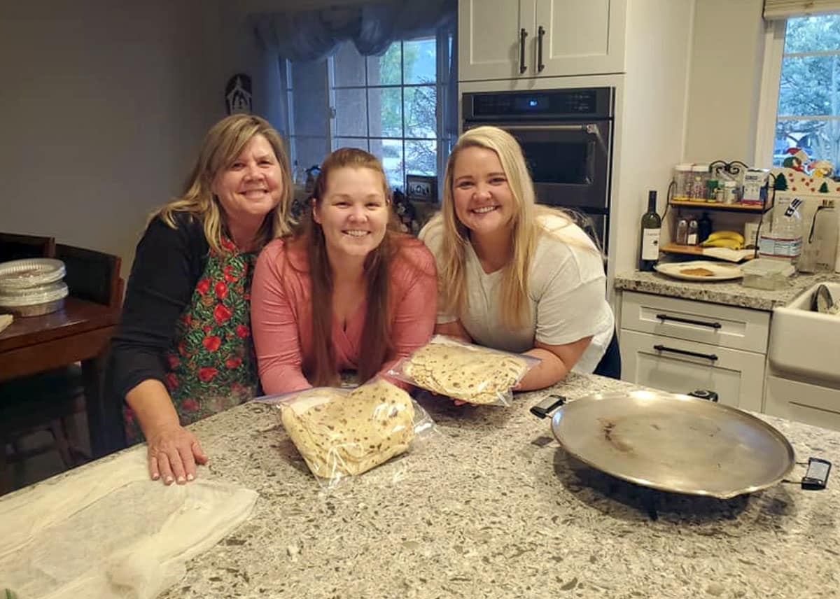 3 ladies in the kitchen making lefse.
