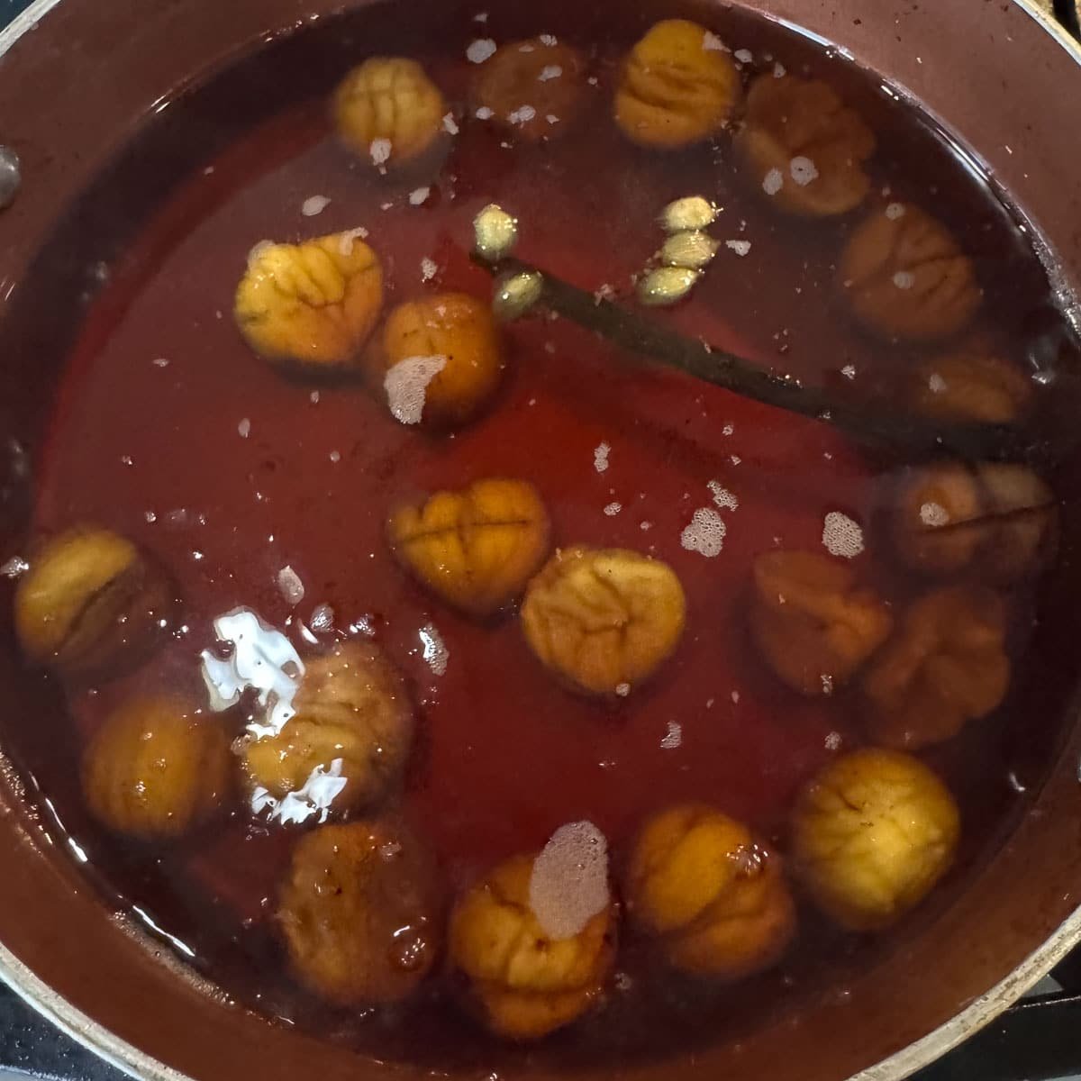 marron glace simmering in syrup.