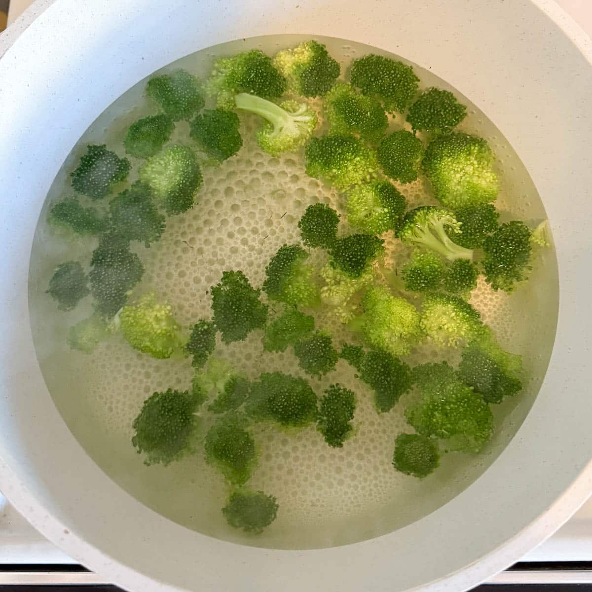 broccoli florets being blanched.