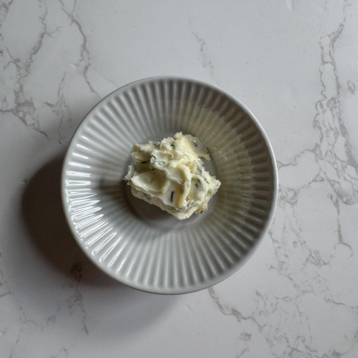 herbed butter in a dish.