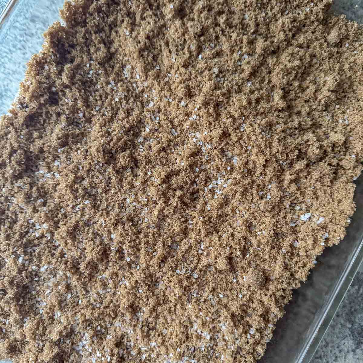 brown sugar and salt mixed in a glass baking dish