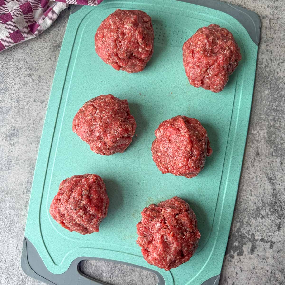 meatballs on a blue cutting board