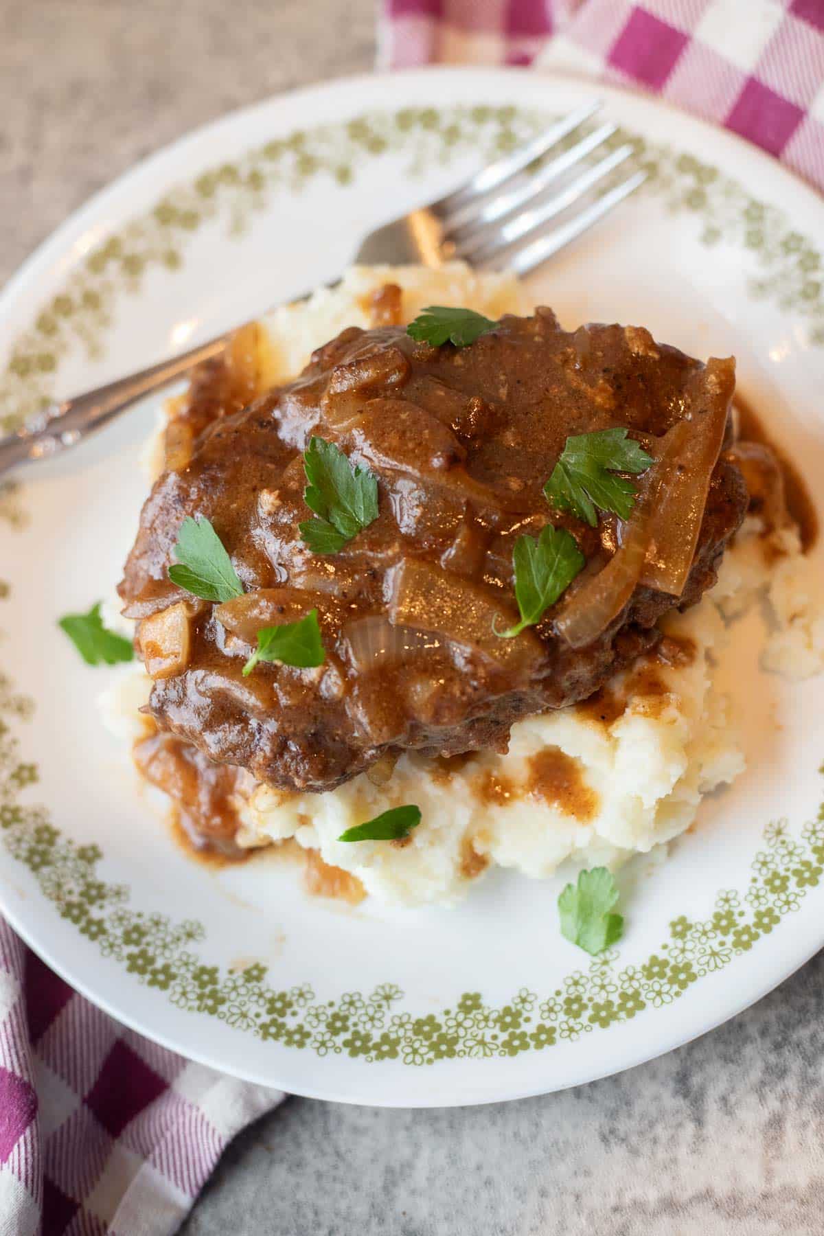 Salisbury steak served over mashed potatoes