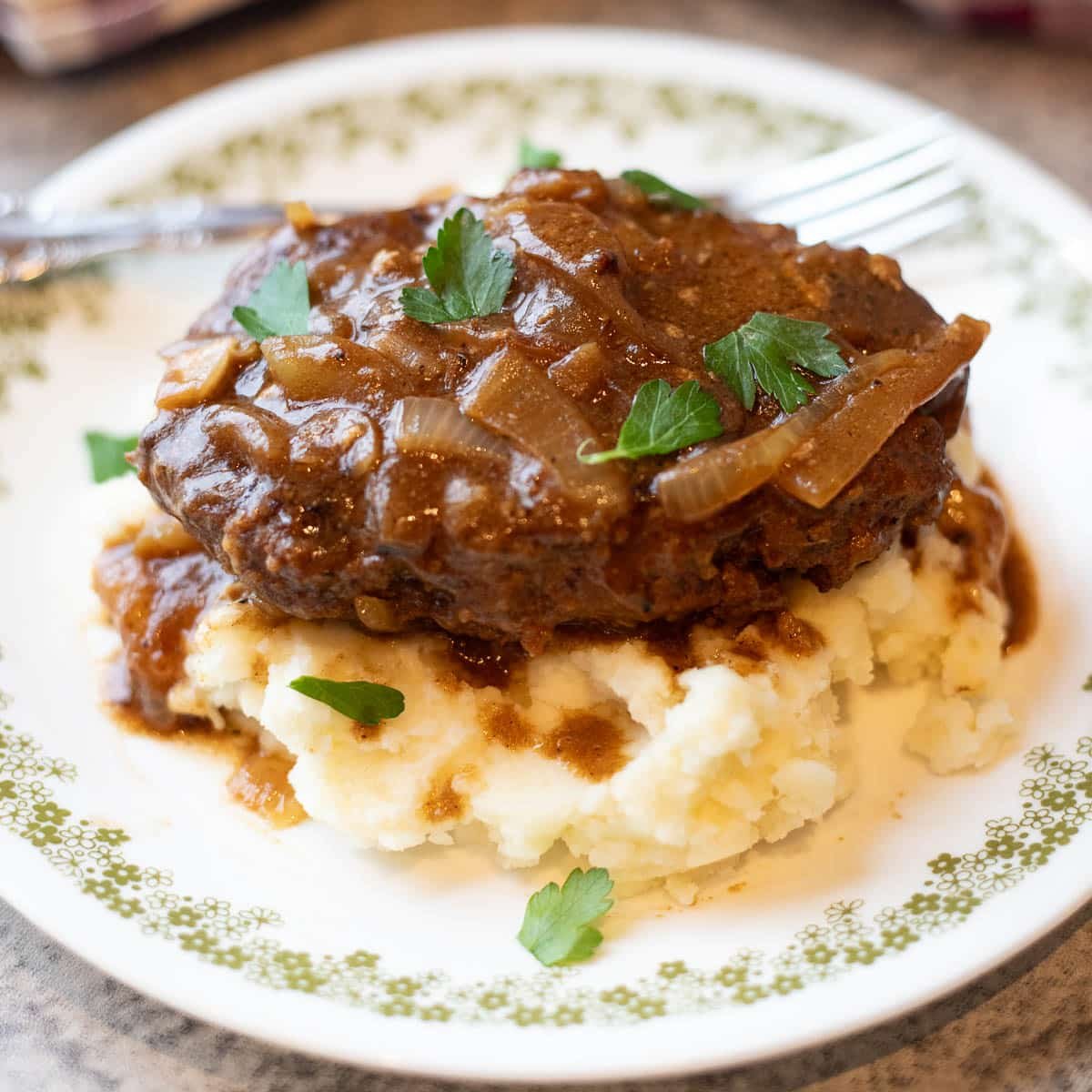 salisbury steak on mashed potatoes