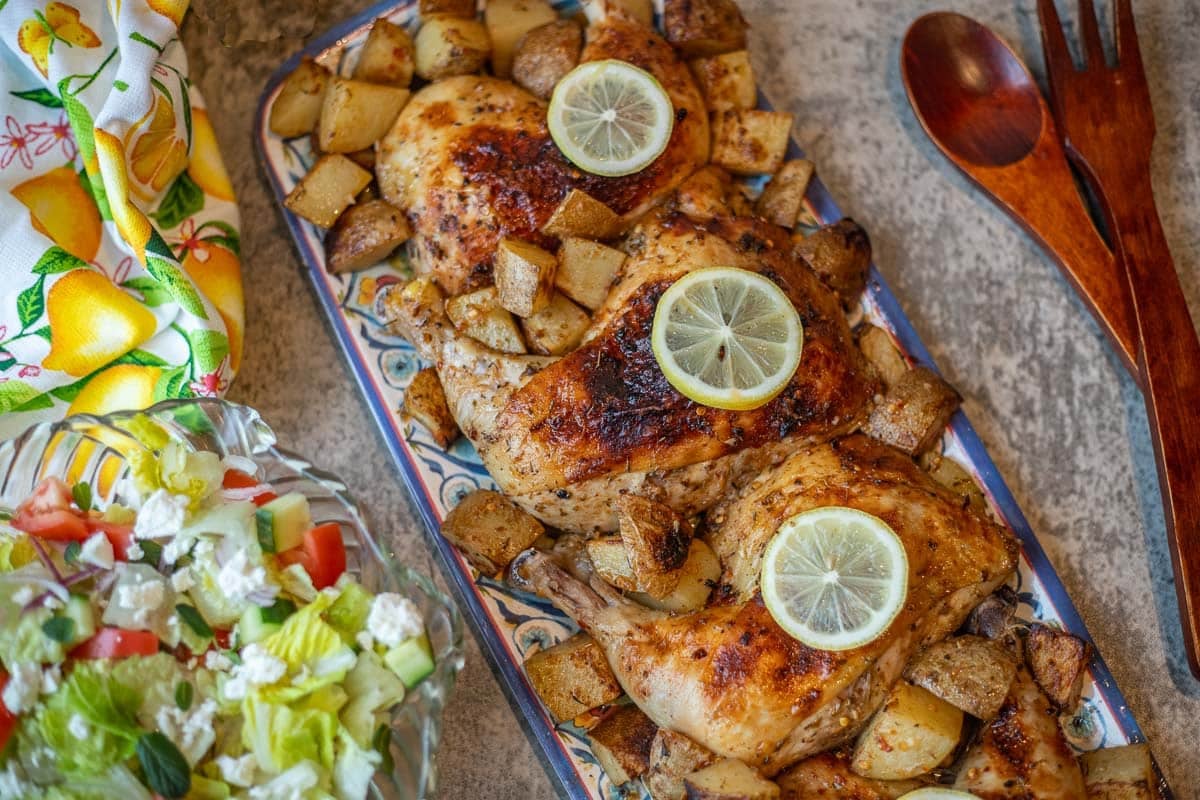 greek chicken with lemon potatoes and a salad 