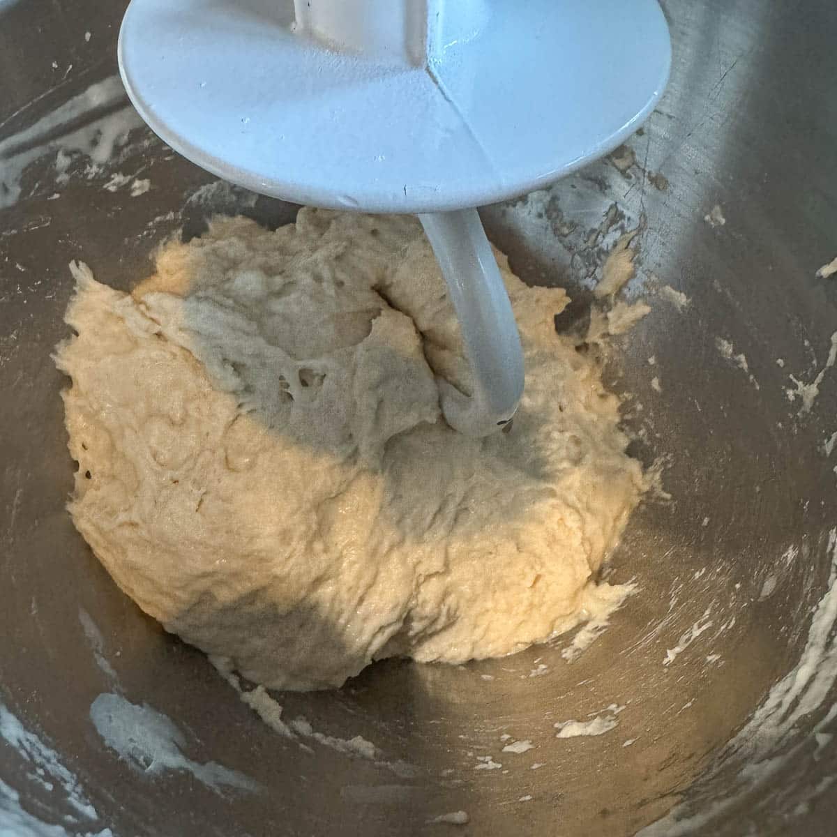 dough being mixed with hook attachment
