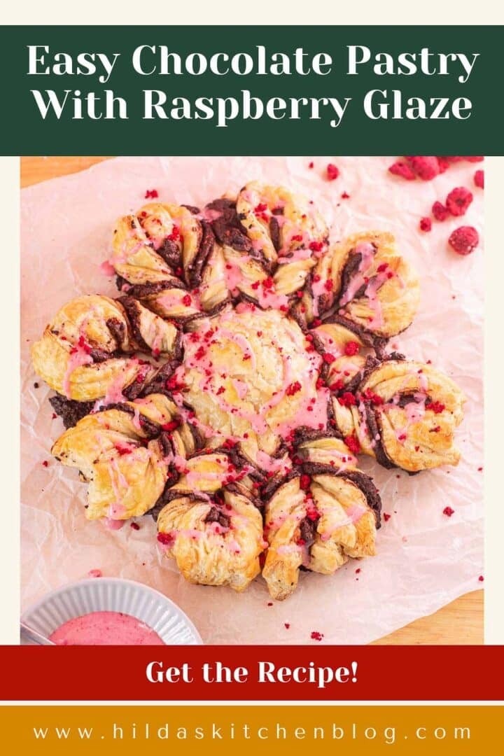 snowflake-shaped chocolate pastries with chocolate, freeze-dried raspberries, and raspberry glaze.