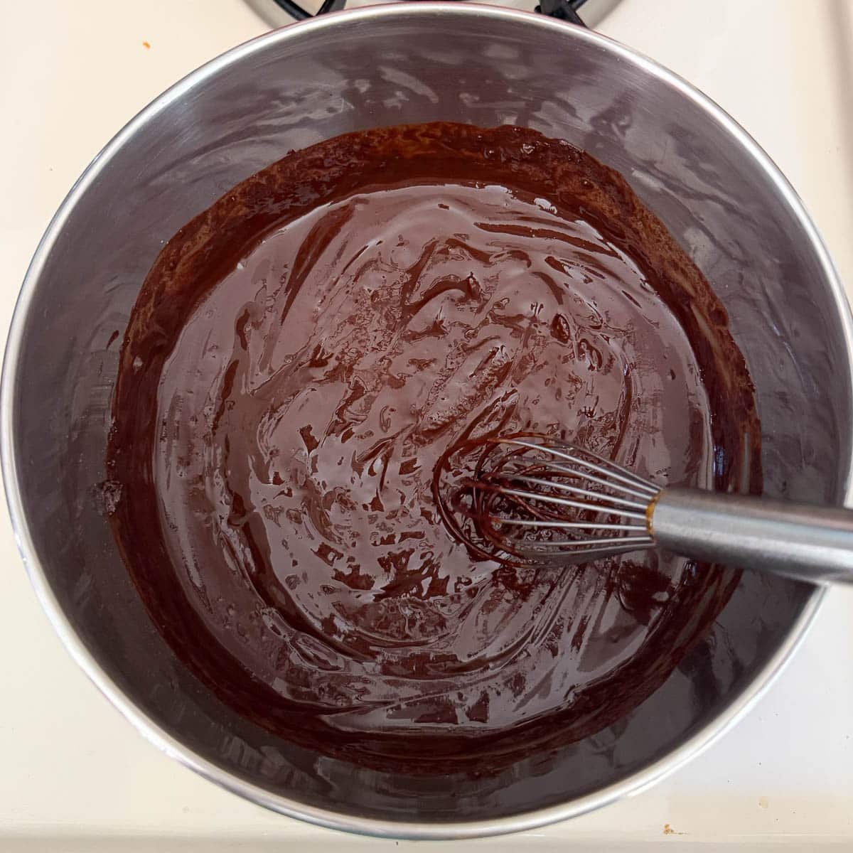 pot after cocoa powder is whisked into the butter.