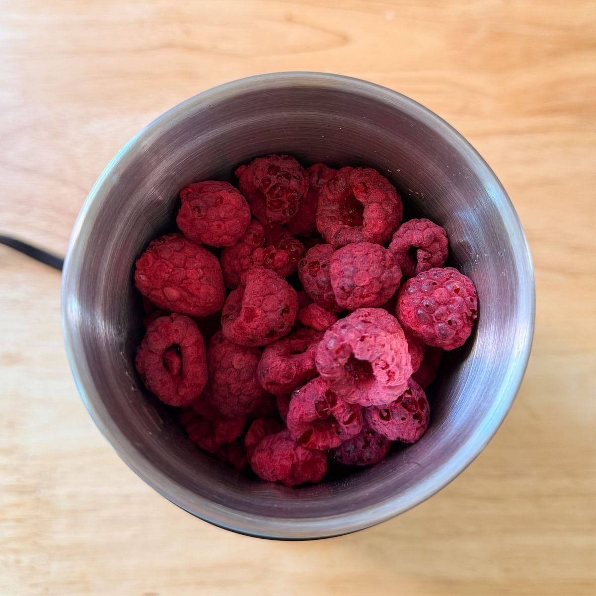 freeze dried raspberries in a spice grinder before processing.