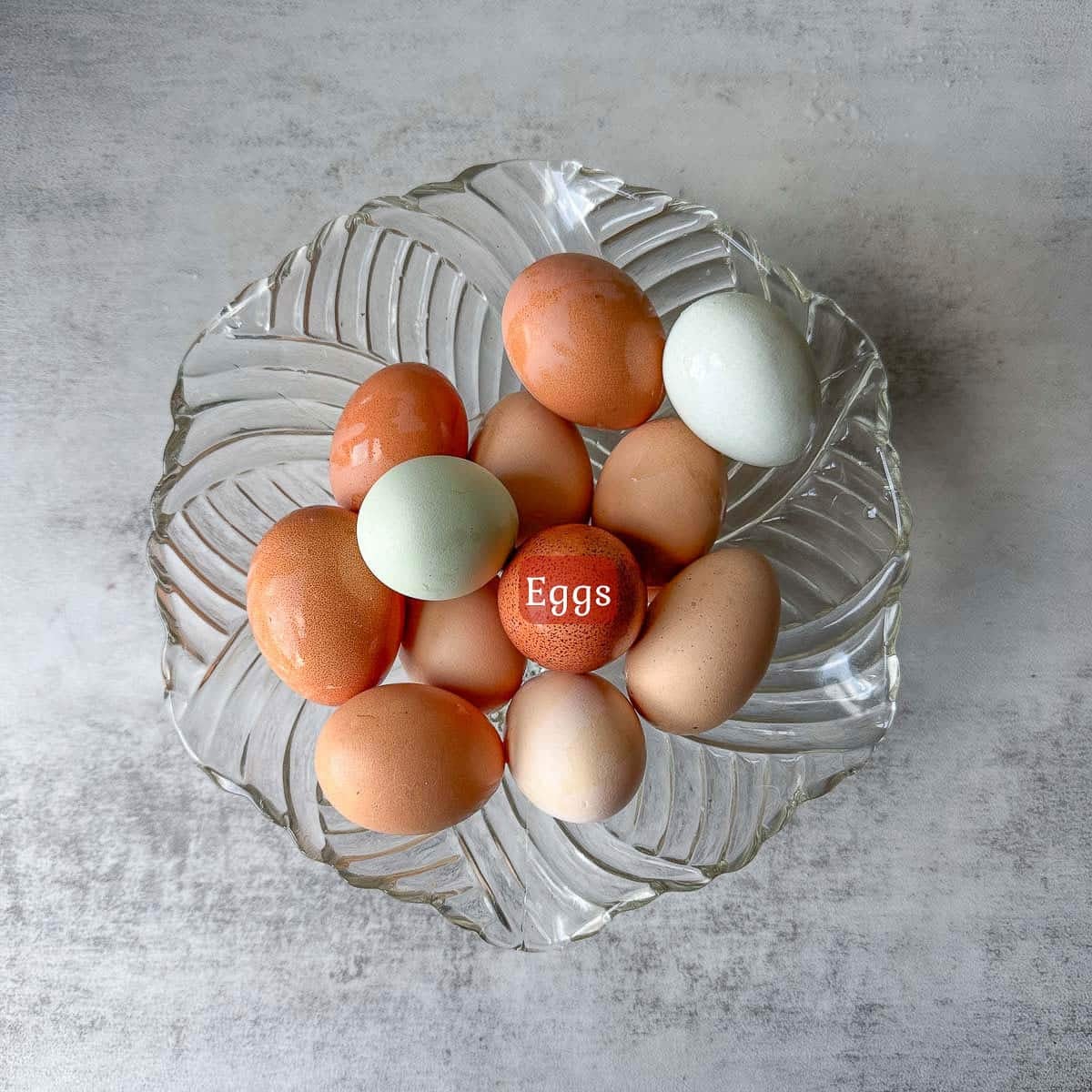 colorful eggs in a glass bowl