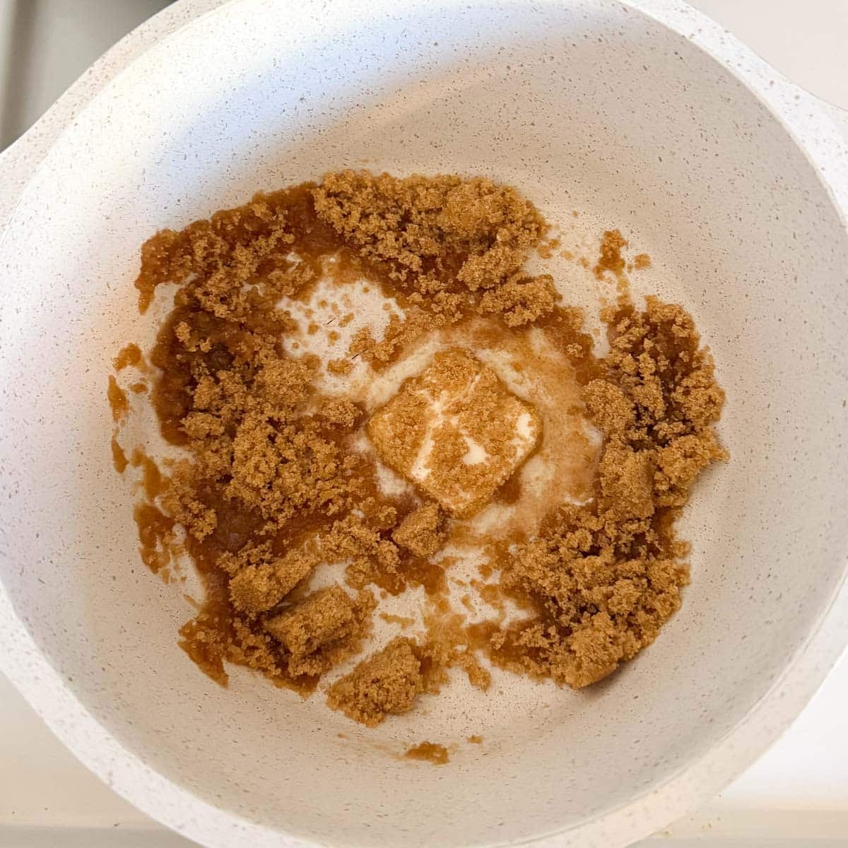 butter and brown sugar mixed in pot.