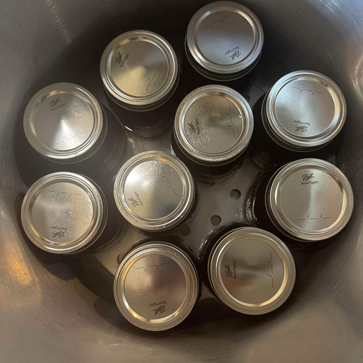 jars of beef bone broth in a pressure canner