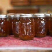 beef bone broth in jars on a red kitchen towel