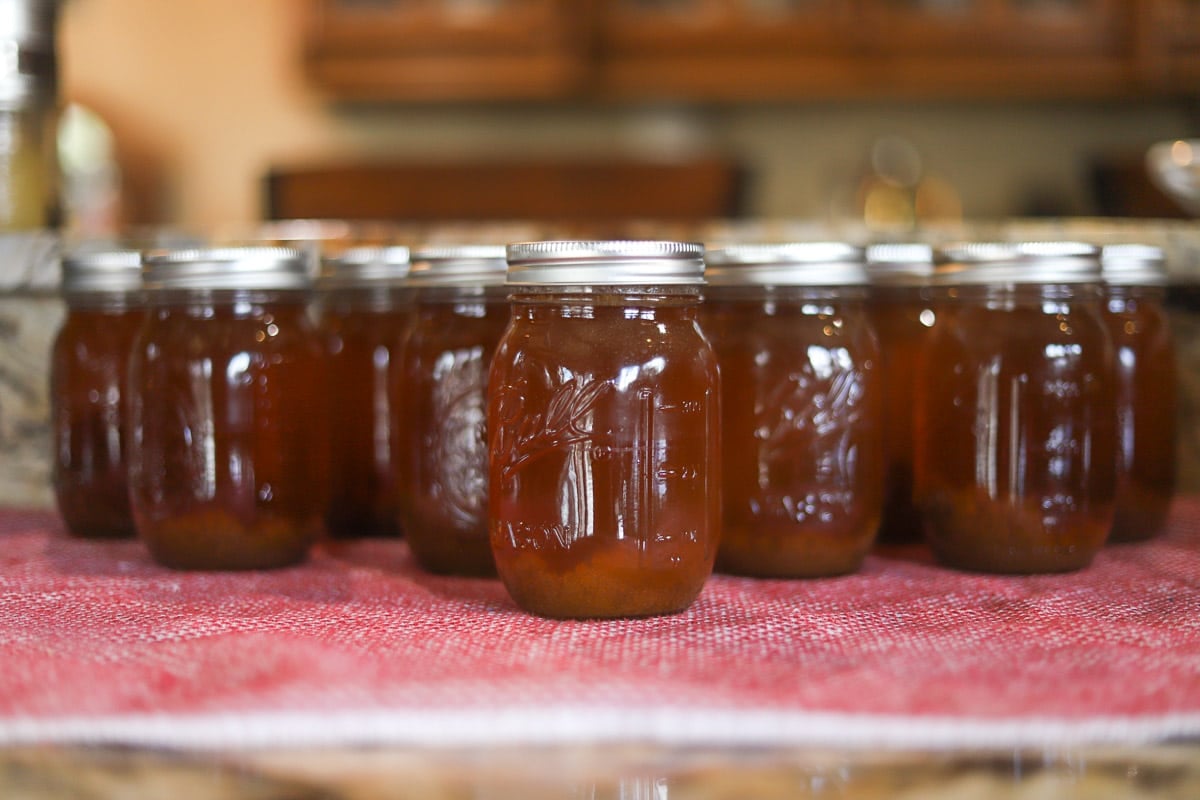 jars of beef bone broth on a red towel
