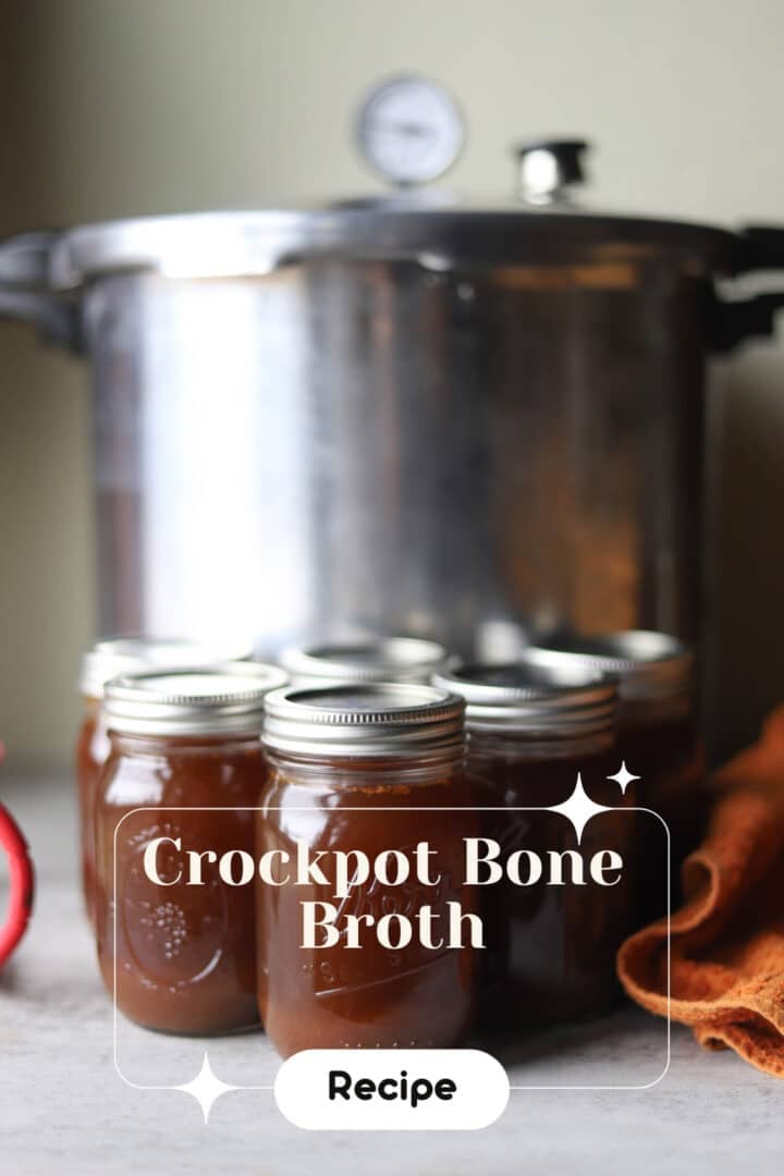 beef bone broth in jars in front of a pressure canner