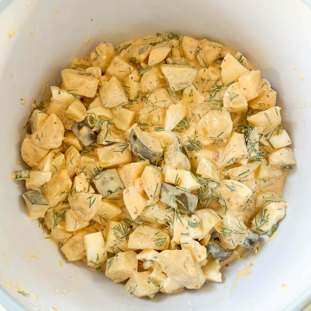 dill pickle potato salad in a bowl
