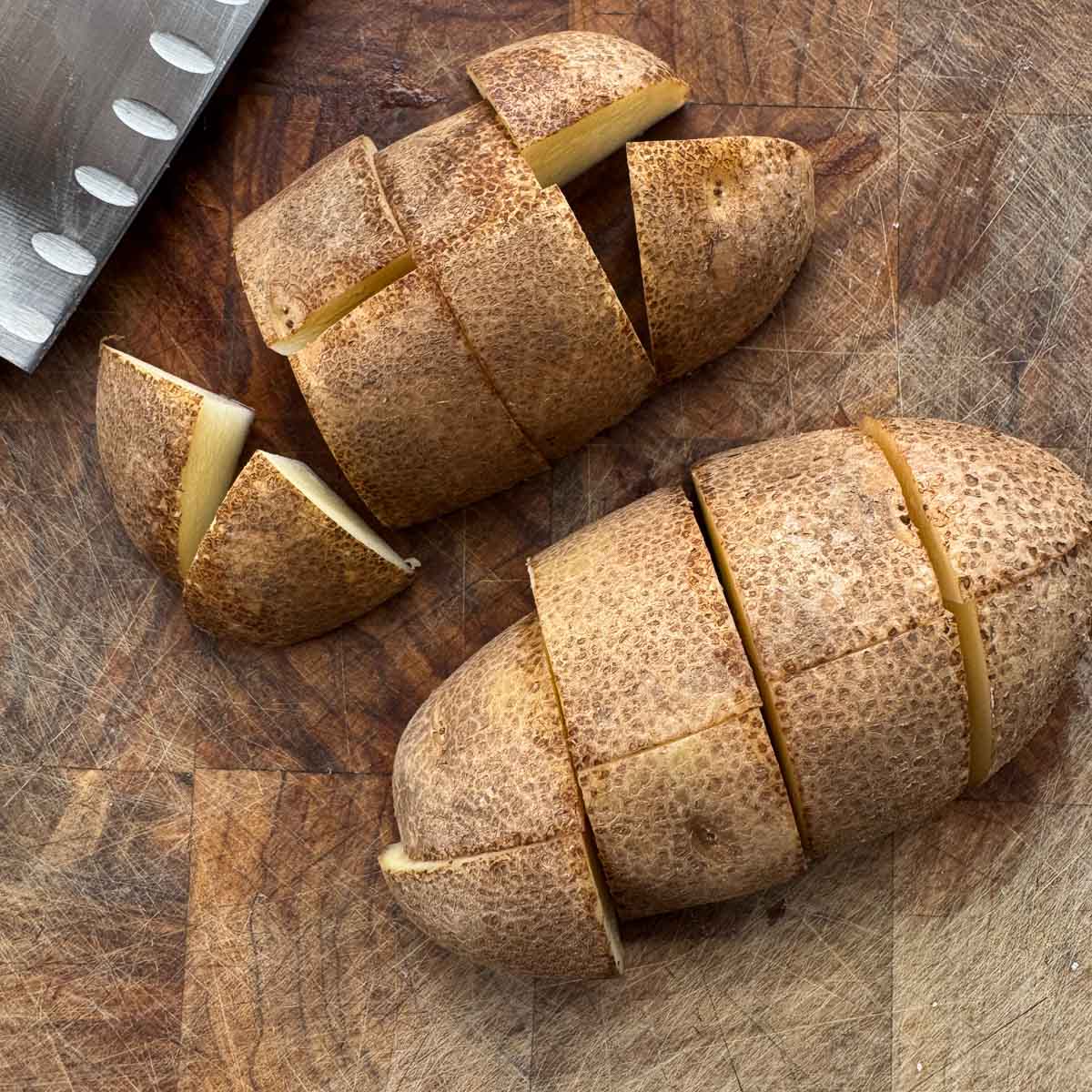 cubed potatoes on a cutting board