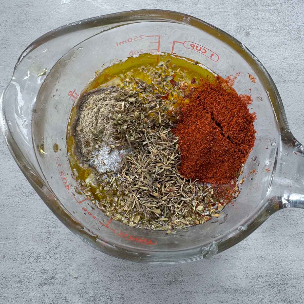 marinade ingredients in a measuring cup, unmixed