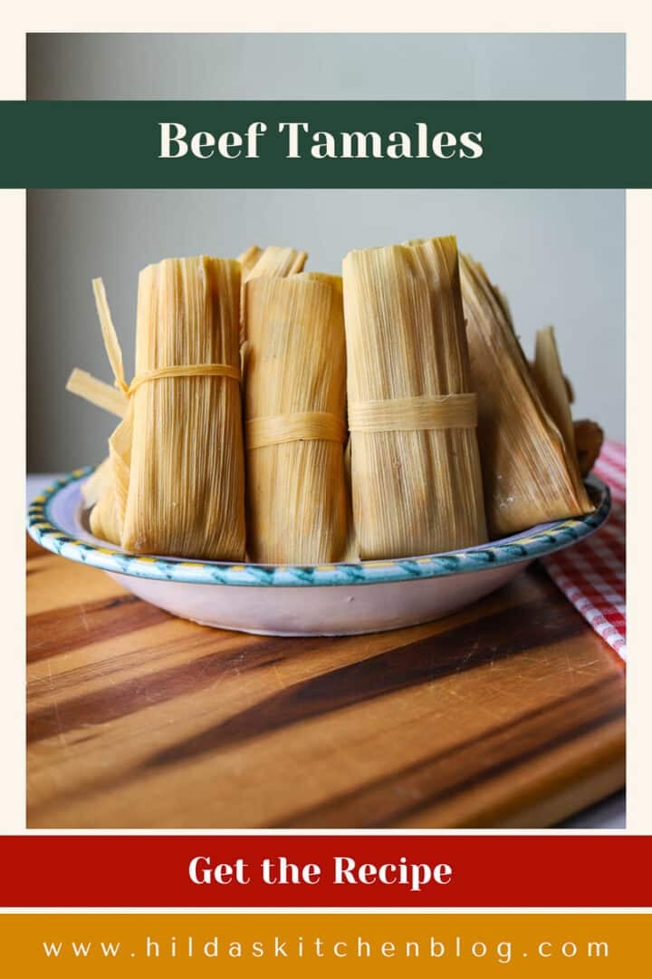 beef tamales in a bowl on a wooden board