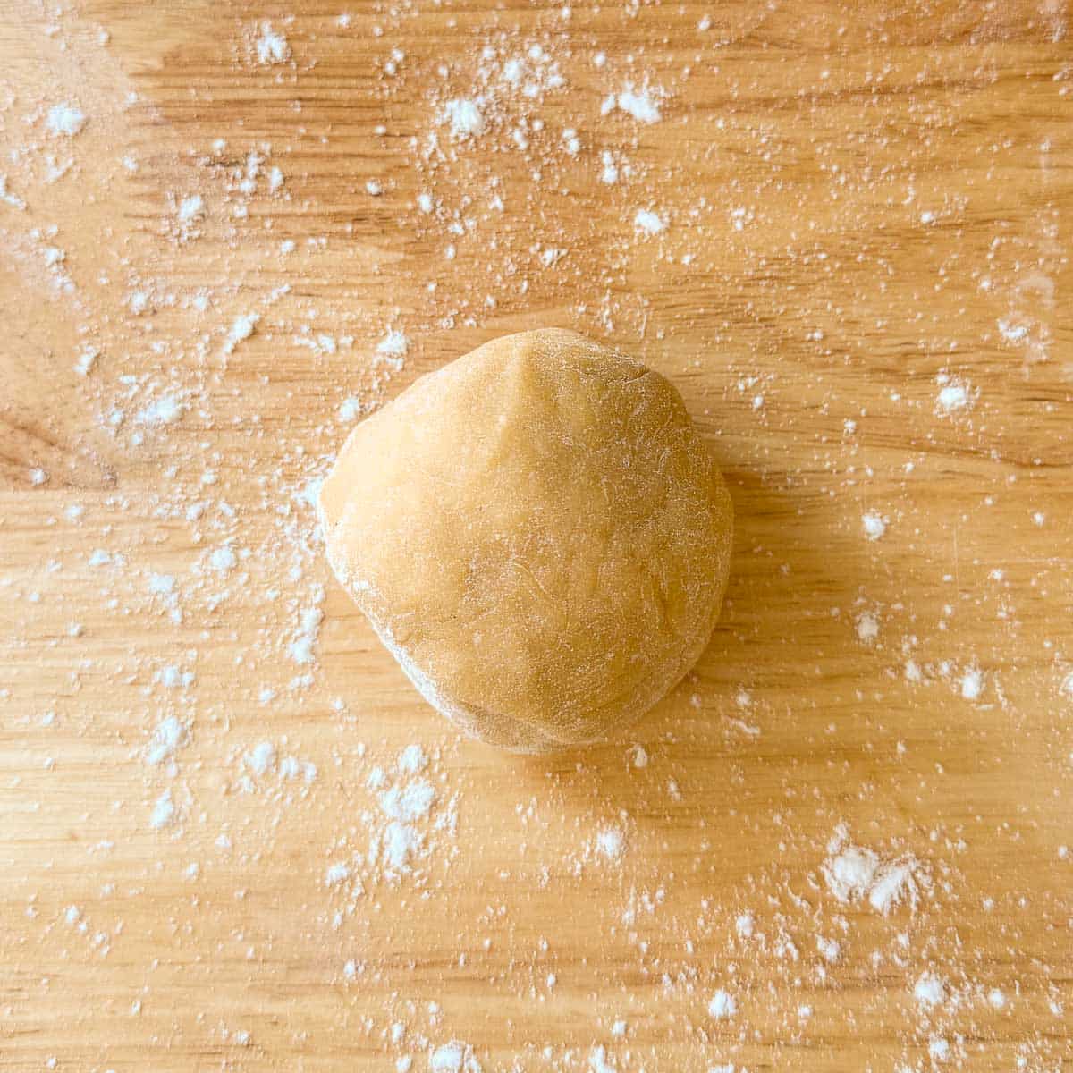 ¼ egg noodle dough ball before rolling.