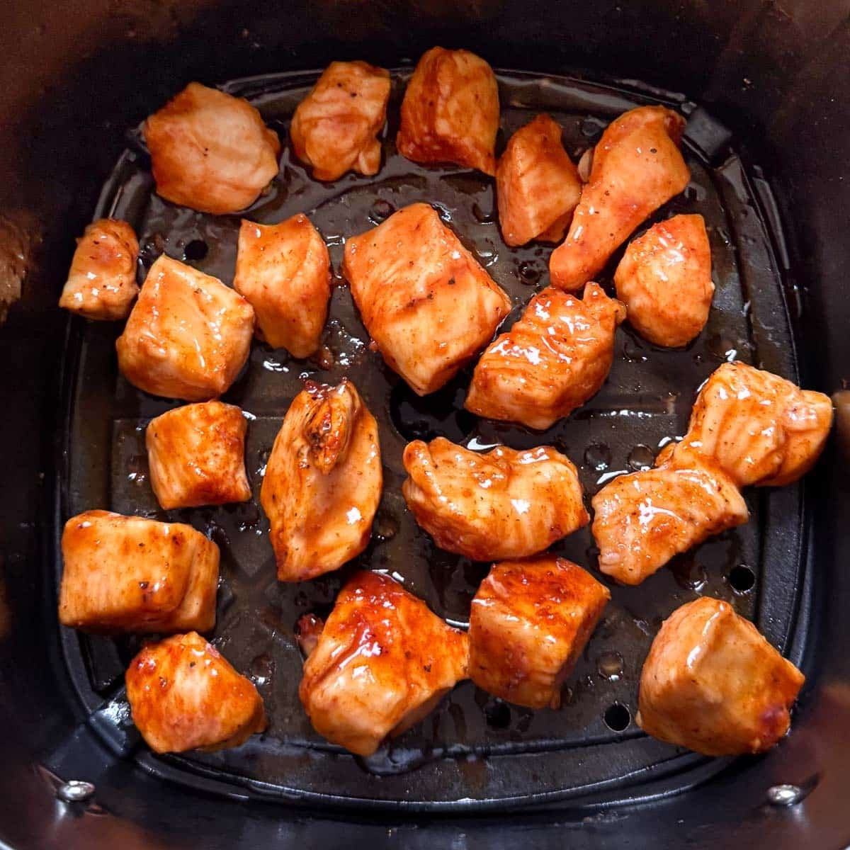 air fryer bbq chicken after brushing with sauce.