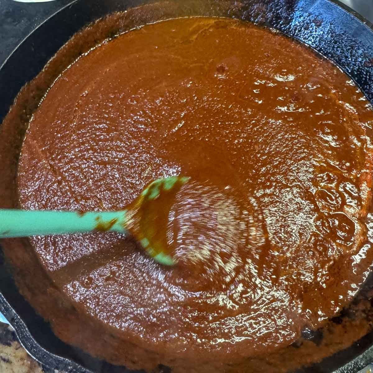cooking chile sauce in a pan