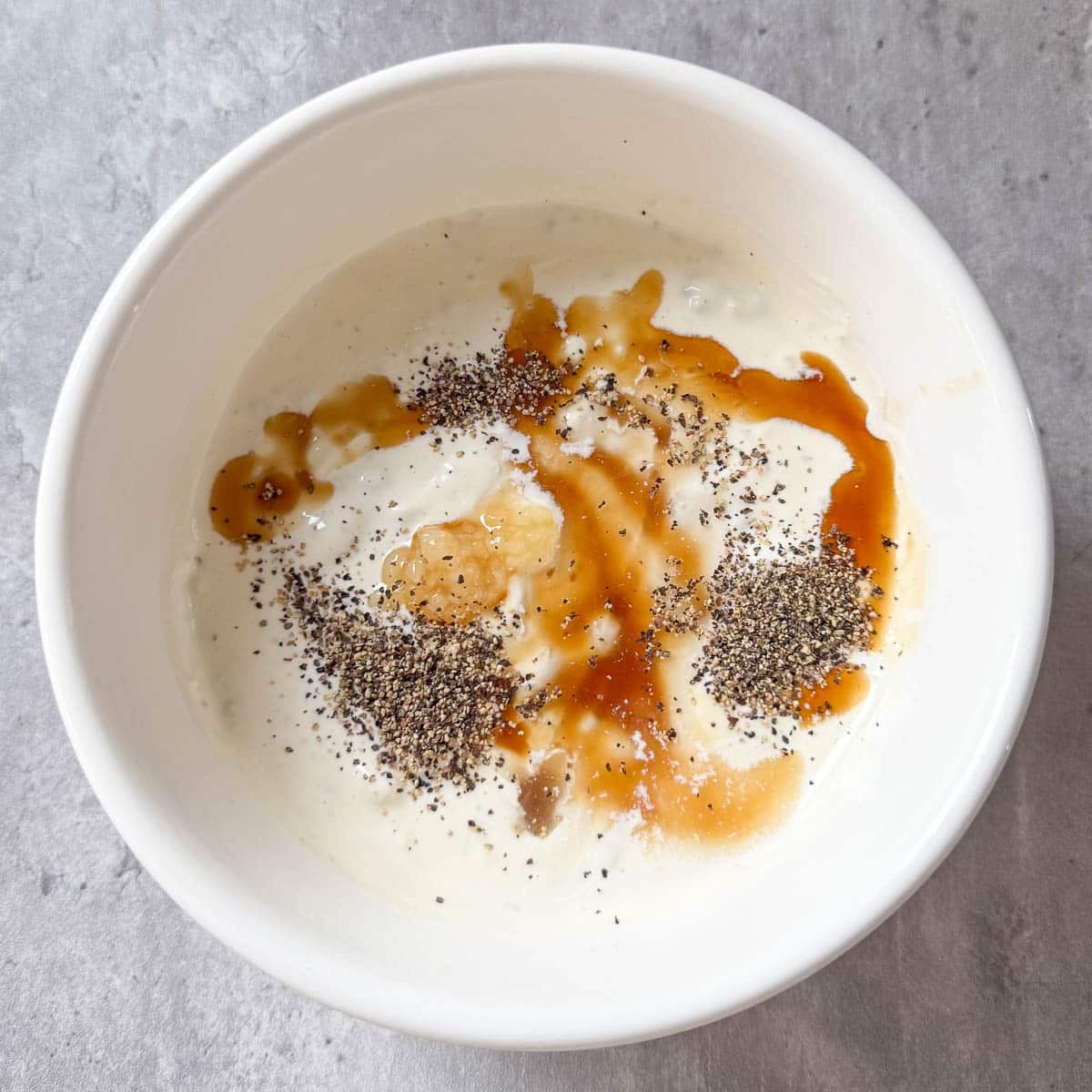 seasonings and sauces added to blue cheese dip before mixing.