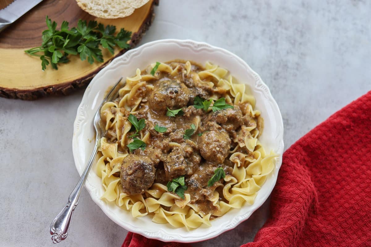 crockpot swedish meatballs and gravy over egg noodles