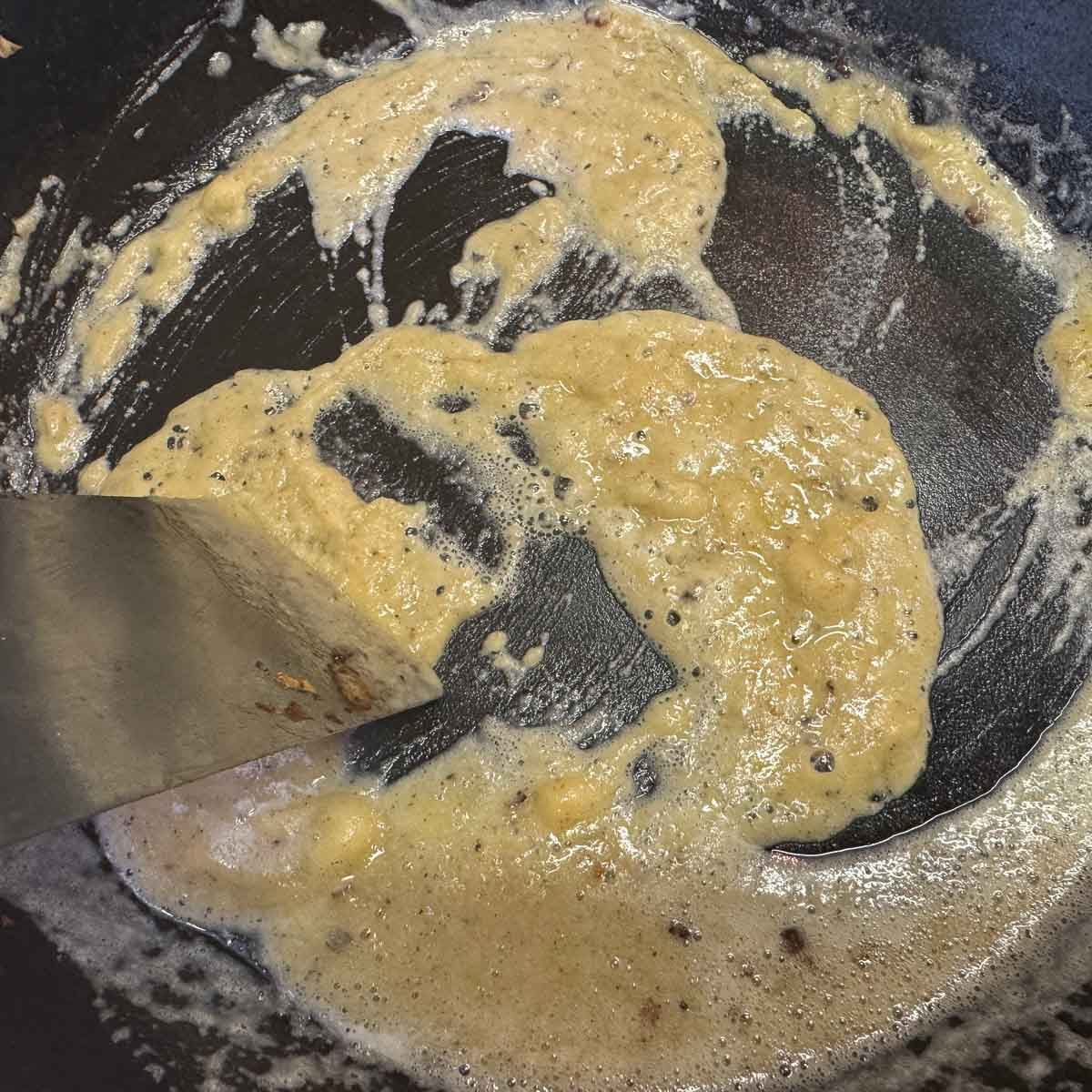 roux being cooked in a skillet