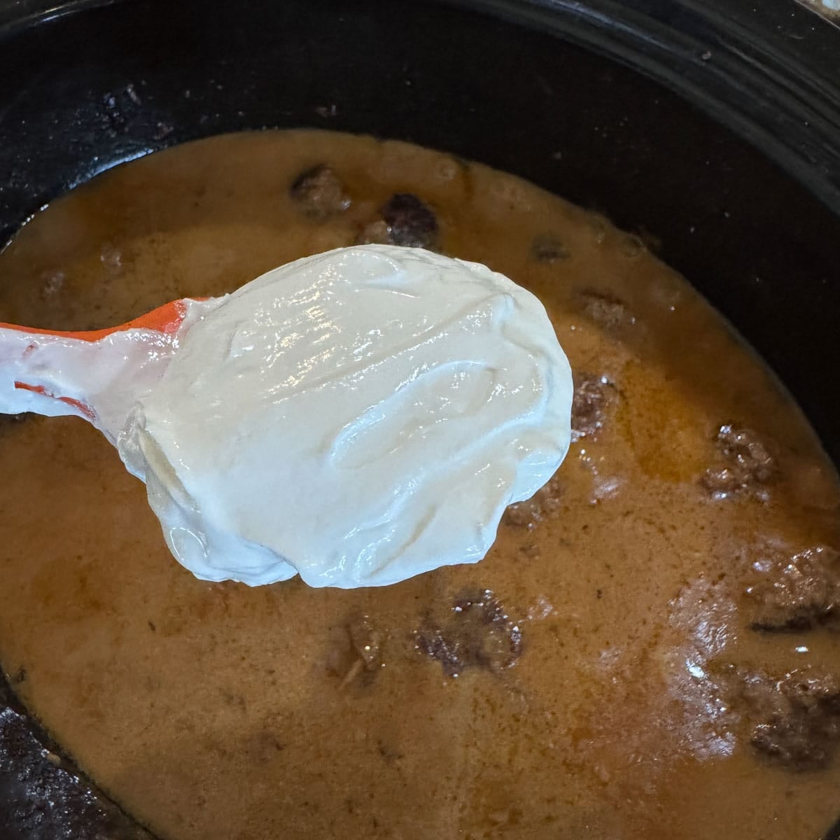 sour cream being added to crockpot swedish meatballs