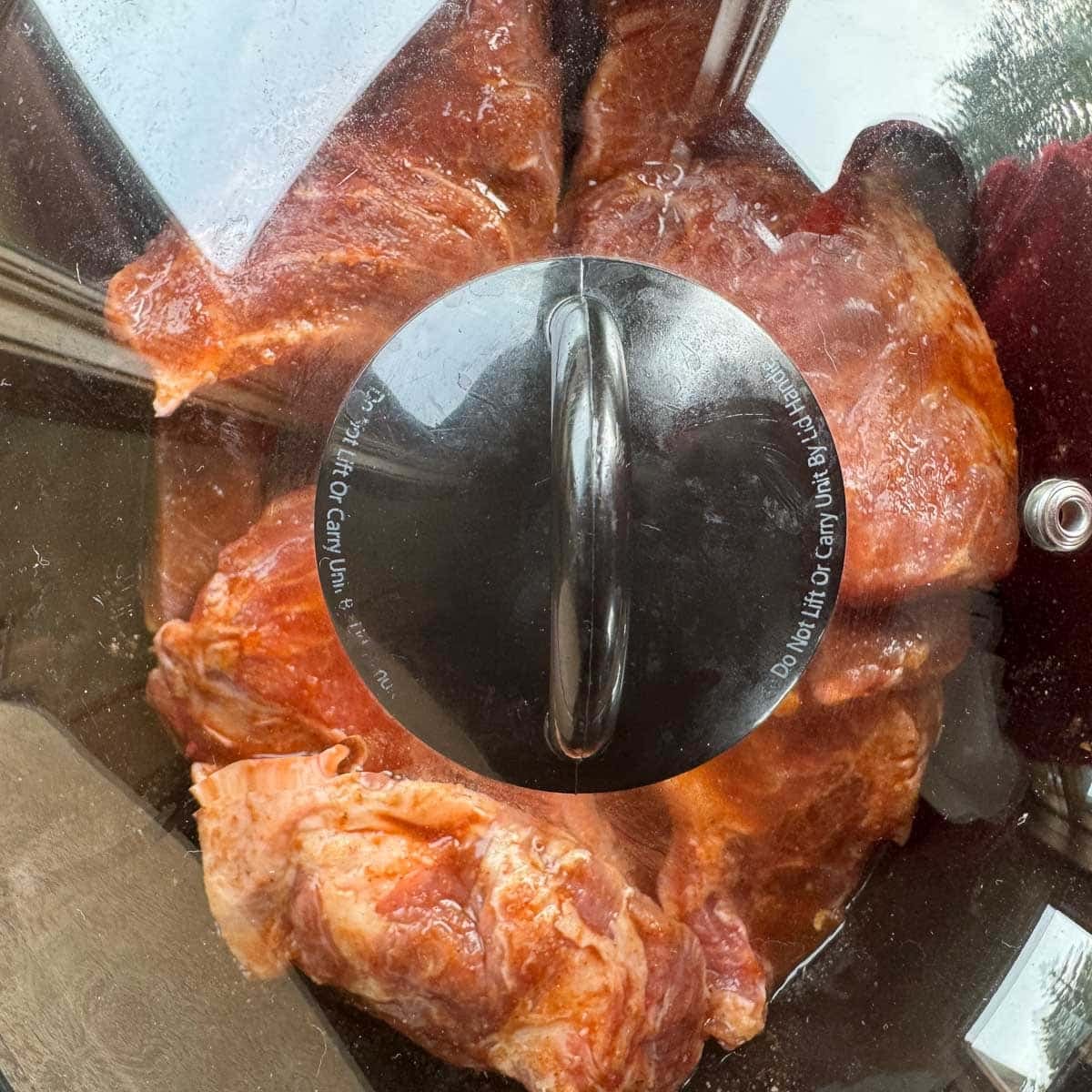 ribs in a crockpot with lid on