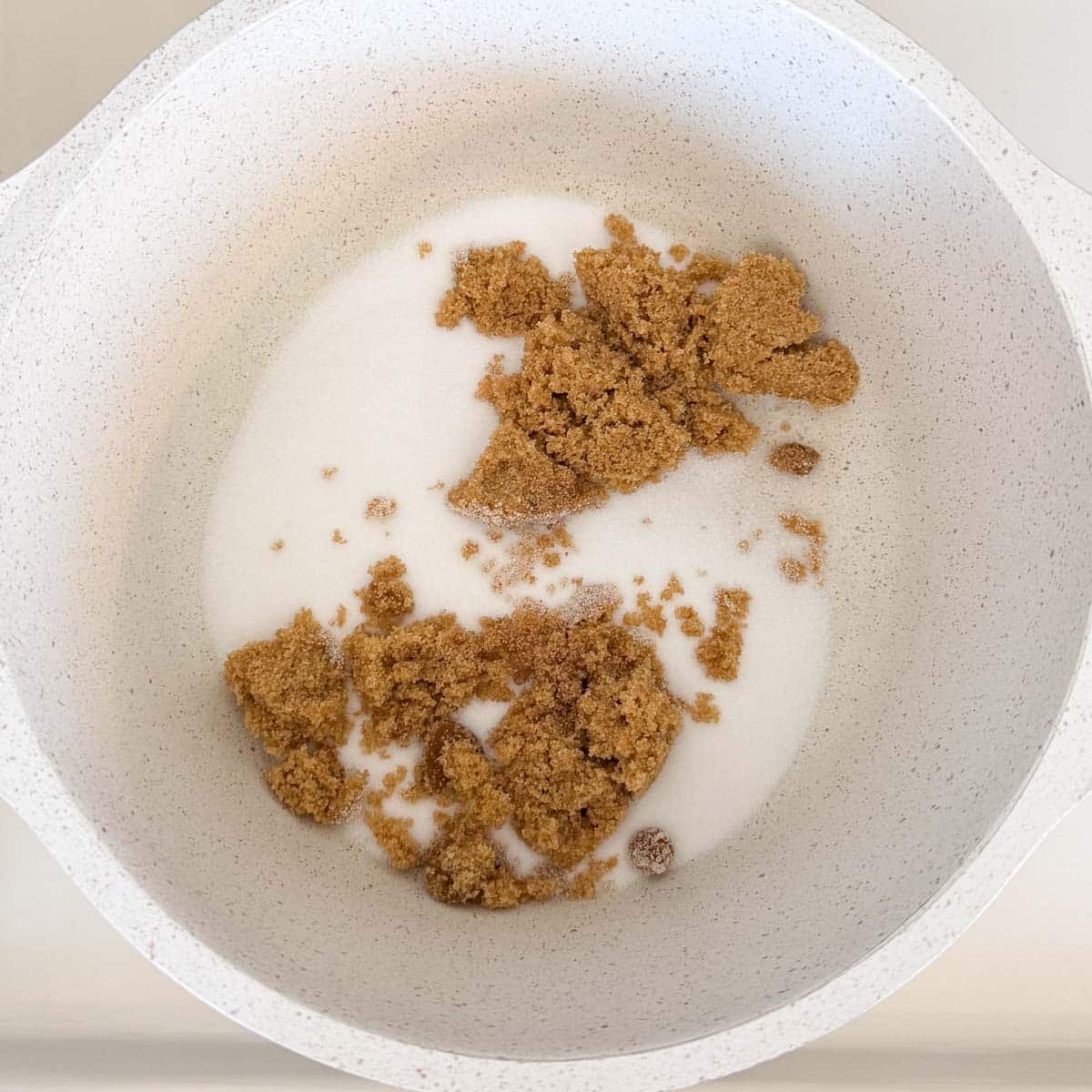 white and brown sugar in pot.