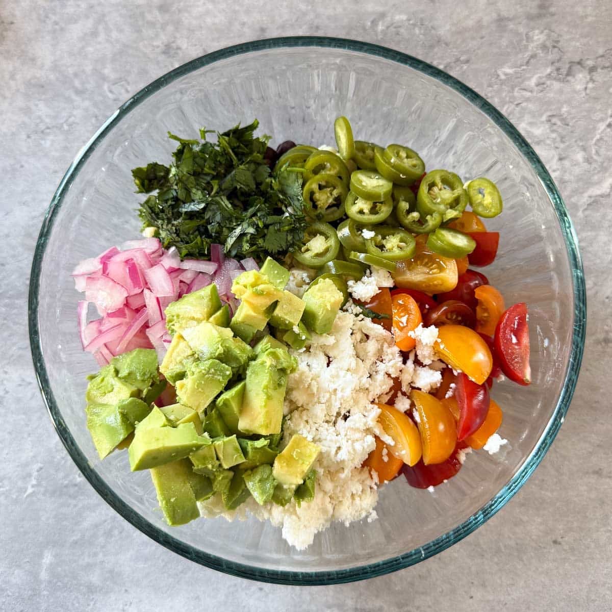 avocado, onion, cheese added to black bean corn salsa.