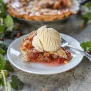 a slice of gooseberry pie with more pie behind it