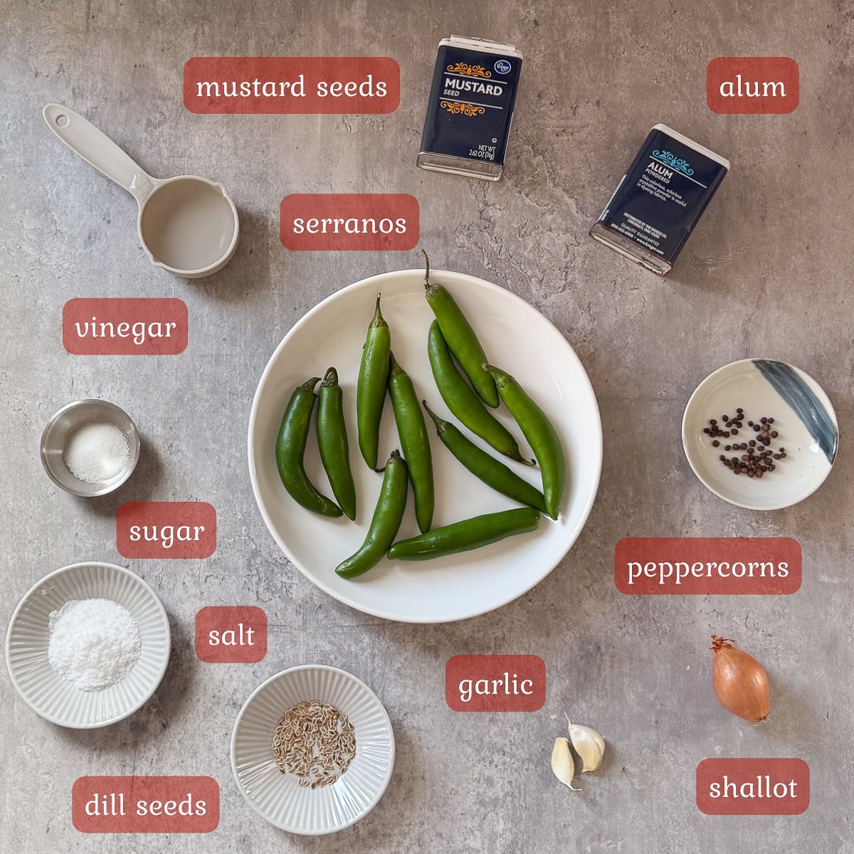 pickled serrano ingredients (peppers, vinegar, spices, etc.)