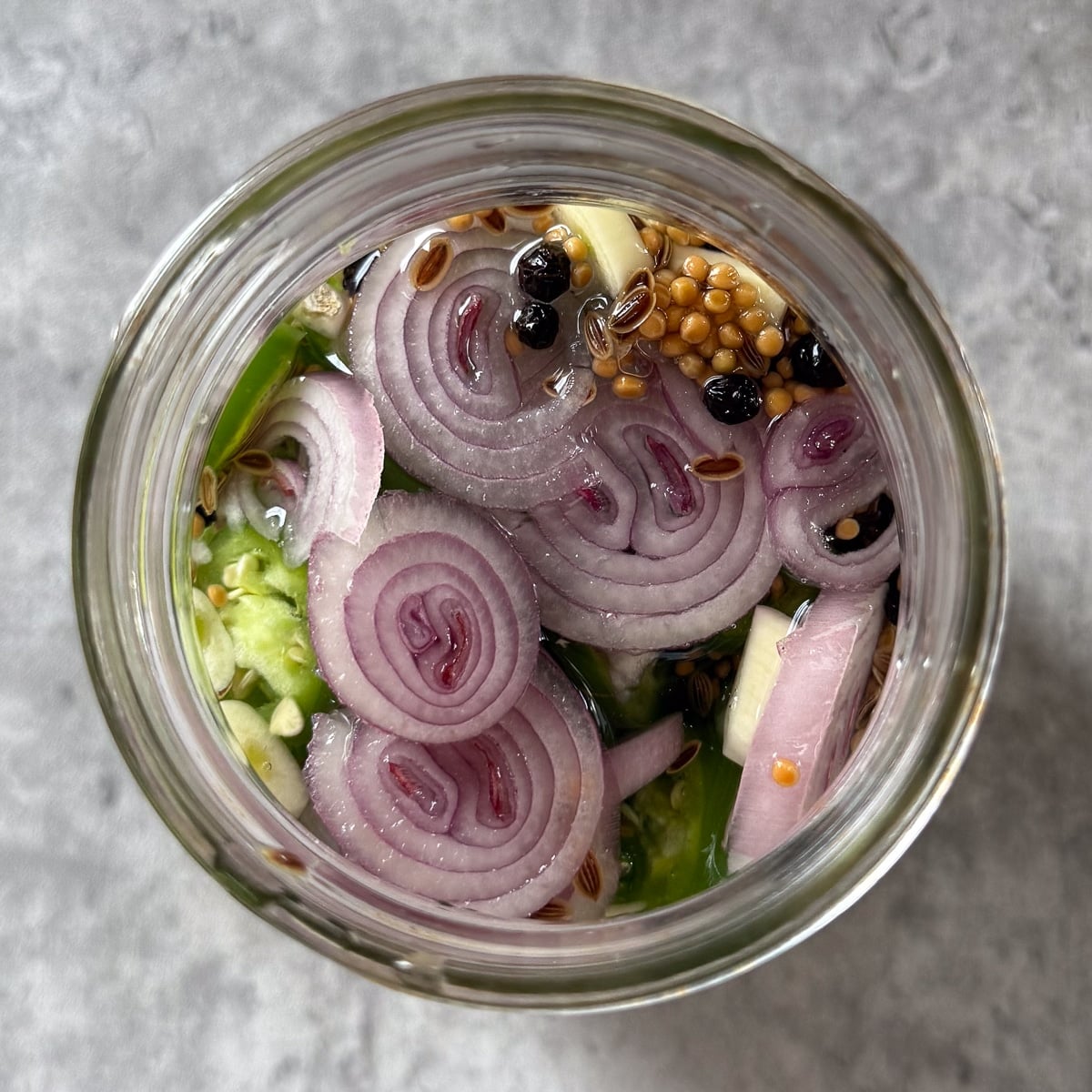 brine added to jar of serranos.