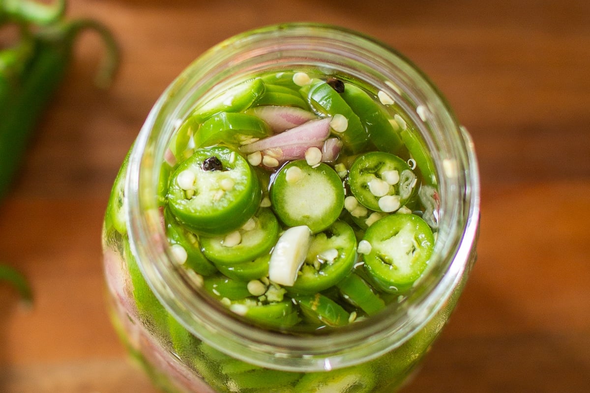 pickled serranos in jar.