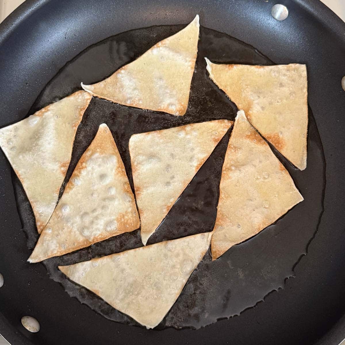 wonton chips frying in oil.